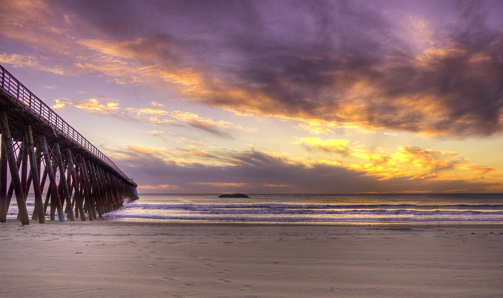 Sunset over the Rosarito pier in purple and gold